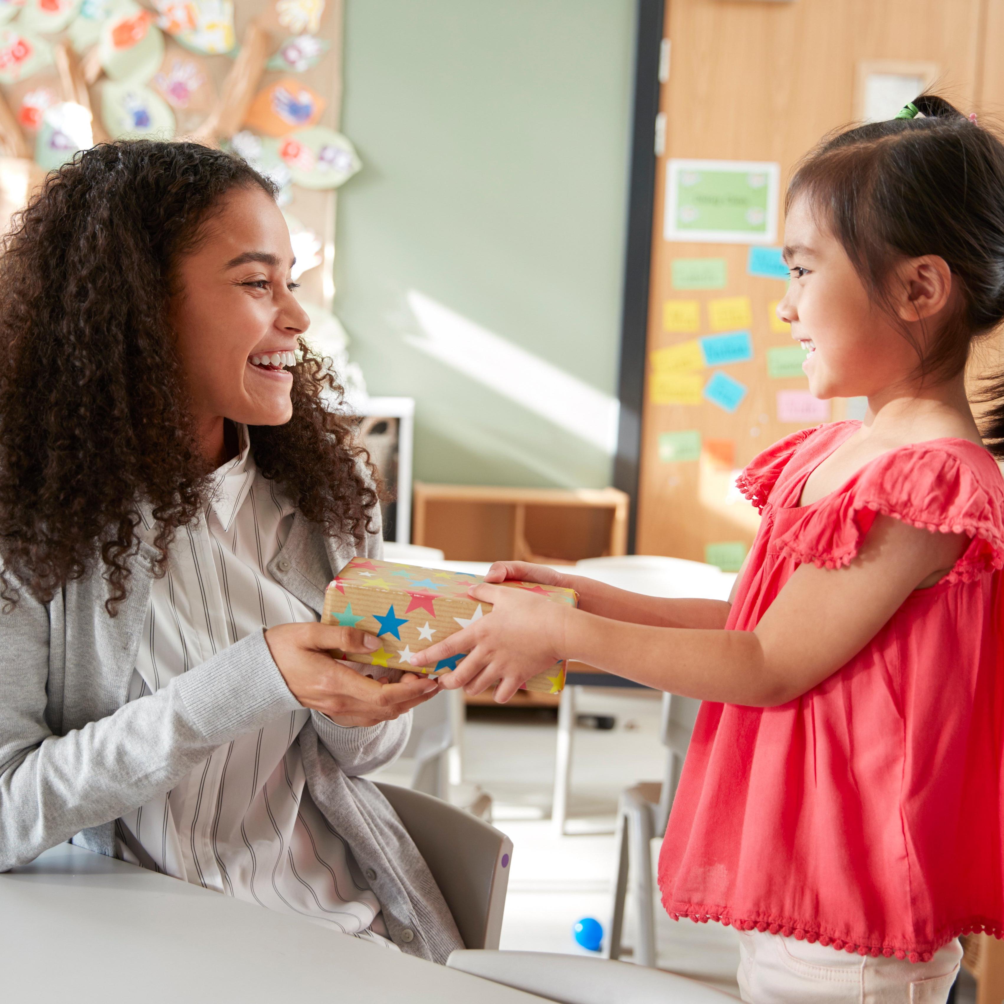 Teacher-receiving-gift-from-young-student
